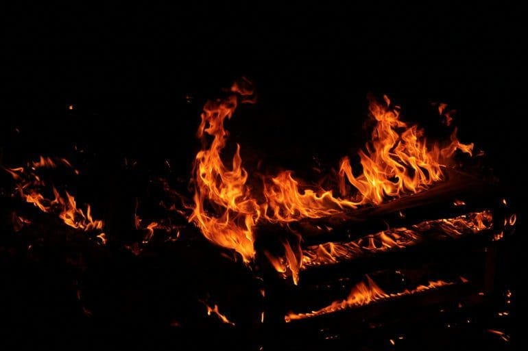 image of a bed on fire