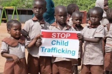 The photo is of young children who through civic education and fear of child trafficking, held peaceful demonstrations to call for immediate action on the criminal act of child trafficking.