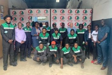 Nzambi Matee pictured with the workers from Gjenge Makers LTD