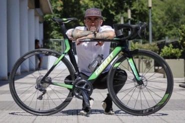 Spanish athlete Rubén López Escudero pictured with his bicycle