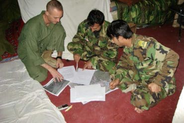 Major Jonathan Bossie of the United States Marine Corps, planning with members of the Afghan National Army.