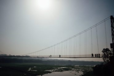 The Morbi hanging bridge in India taken prior to renovations and the bridge collapse
