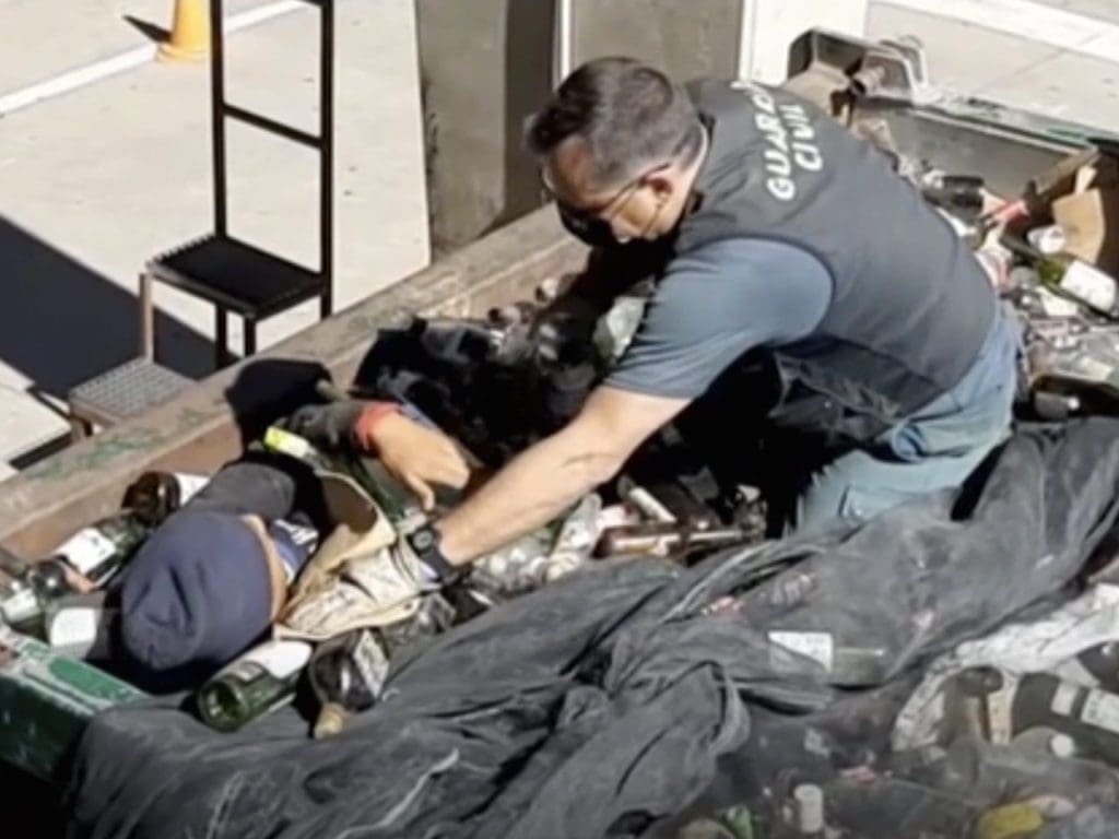 Spanish national police checking the containers where the bodies were found alive.
